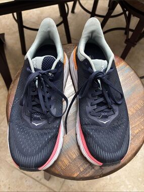 Hoka women’s Navy Running Shoes with Light gray Lining and Coral Accents